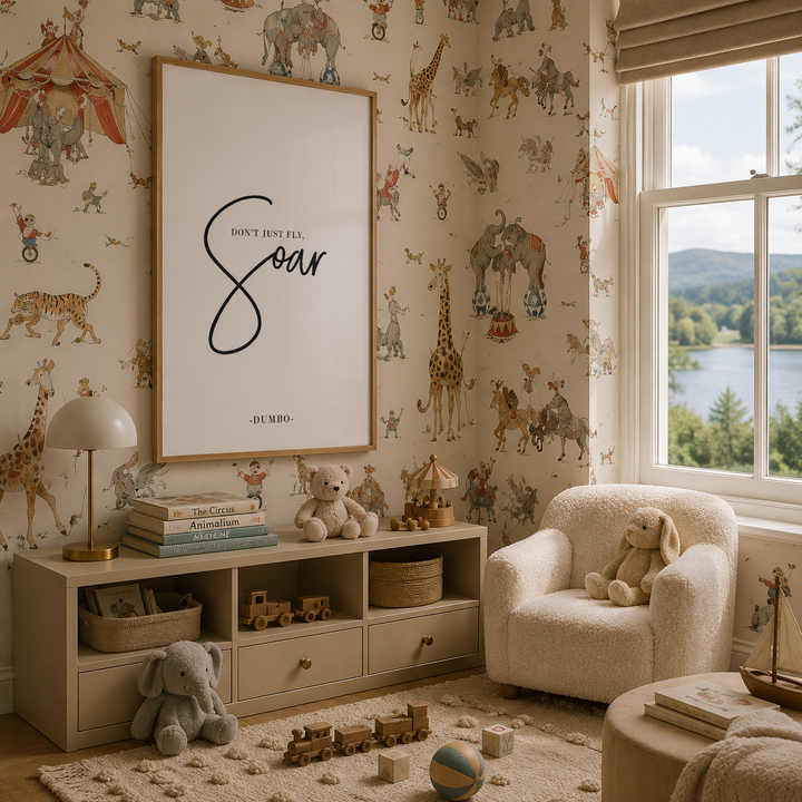 A styled children's room featuring a large framed 'Don't Just Fly, Soar' art print on the wall above a light wood storage cabinet. The room is decorated with whimsical DUMBO circus-themed wallpaper, a cream armchair with a stuffed bunny, and various toys on a plush rug.