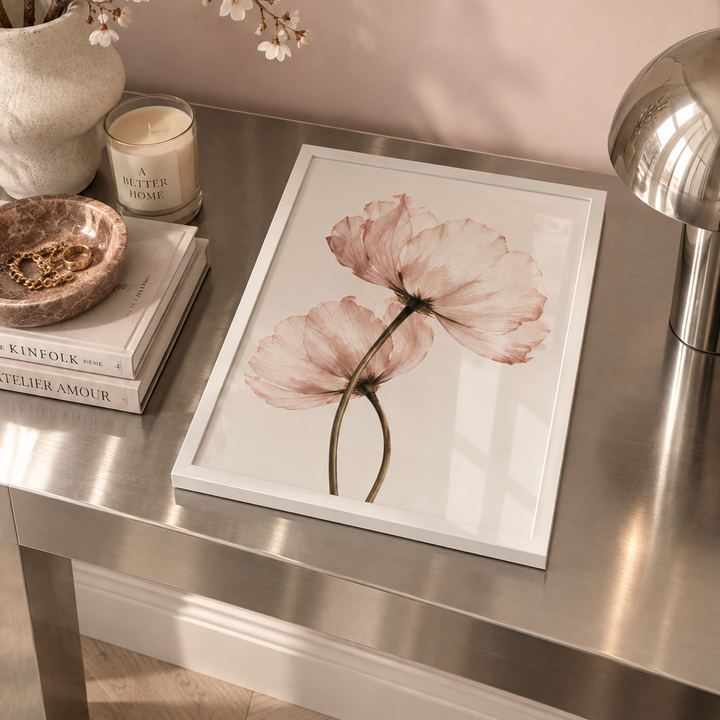 In Bloom Poster featuring two delicate translucent blush pink flowers with sweeping stems against a soft warm ivory background.