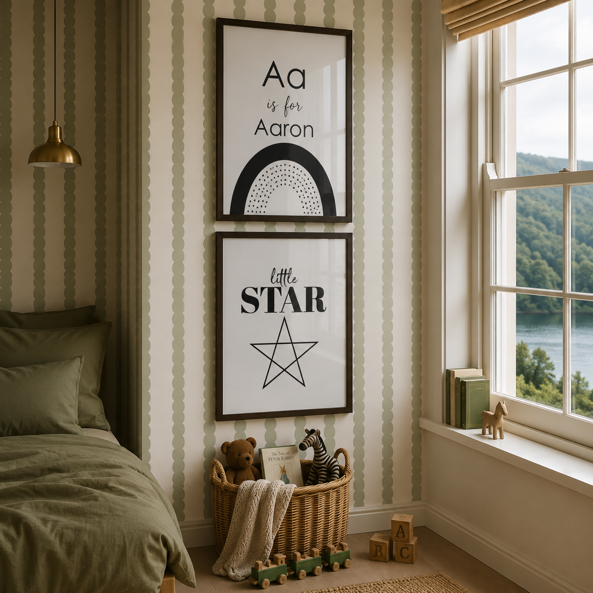 Two framed vertical wall art prints hang on a cream and olive striped wallpapered wall in a styled children's bedroom. The top print reads 'Aa is for Aaron' with a black arch motif, and the bottom print reads 'little STAR' with a star outline.