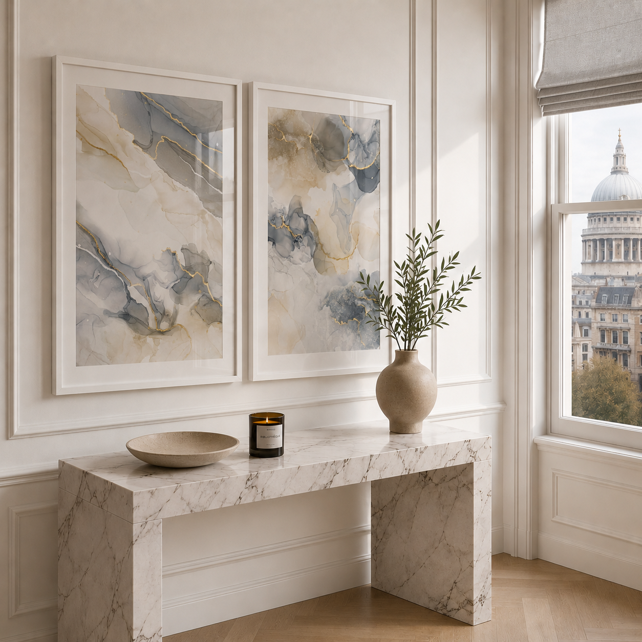 Marble console table with abstract art, a vase, and a candle in a room with a window view of a cityscape.