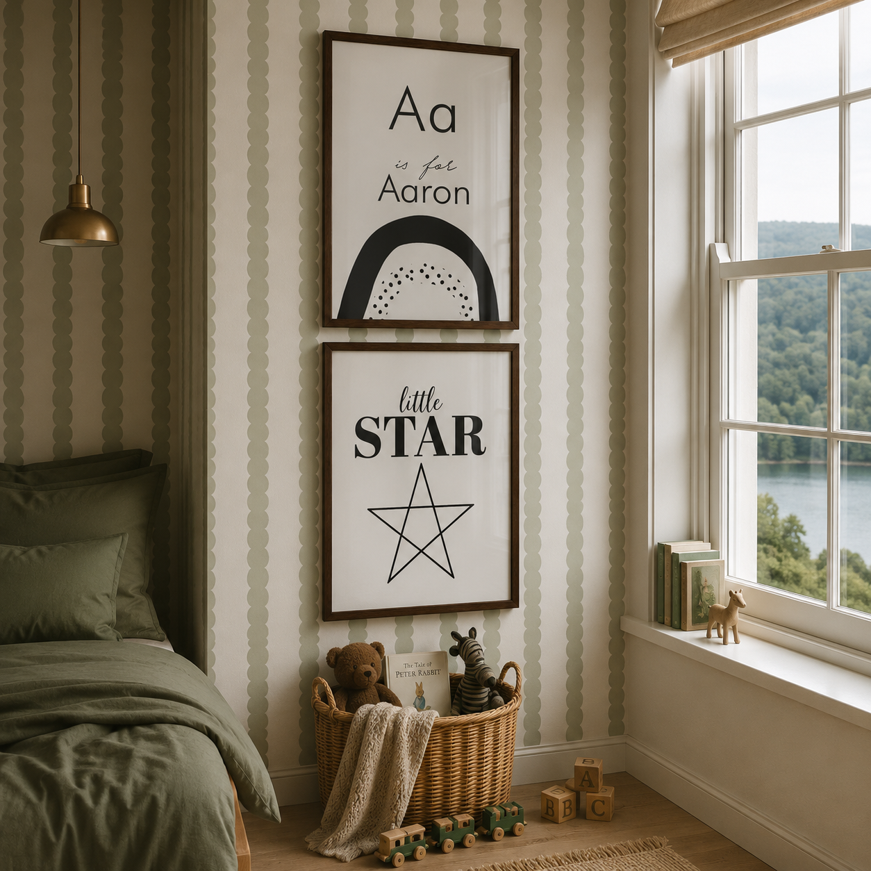 Two framed nursery wall art prints hanging on a striped wallpaper wall in a child's bedroom. The top print reads 'Aa for Aaron' with a black arch and dotted semicircle, and the bottom print reads 'little STAR' with a star outline.