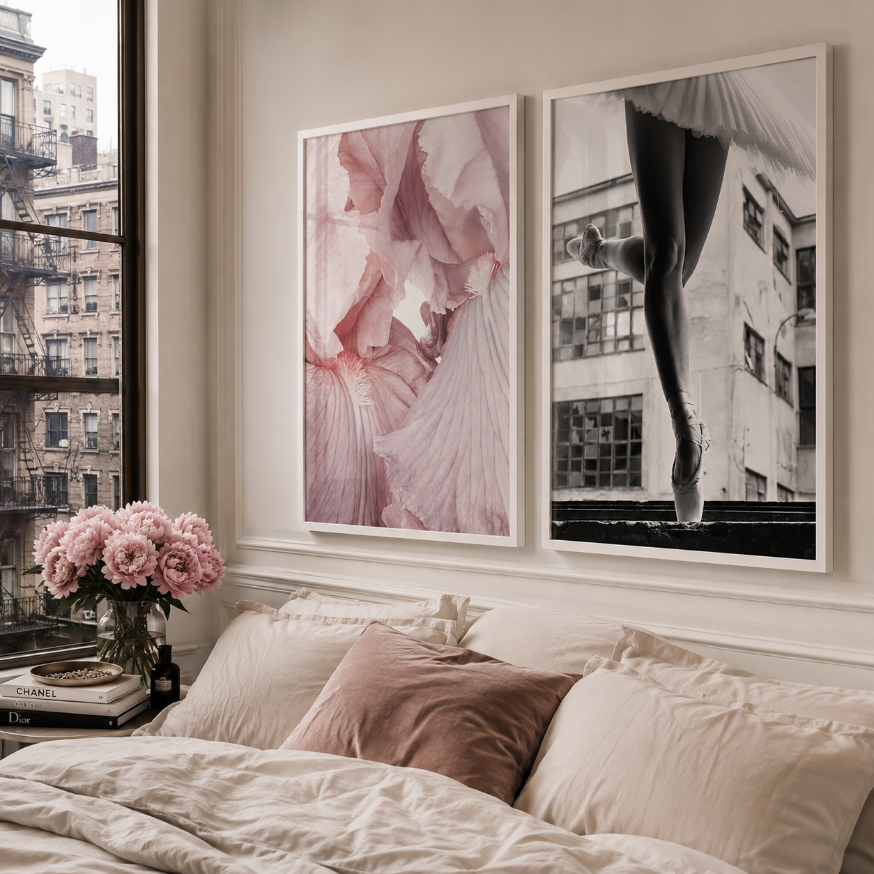 Two framed wall art prints hang above a bed in a softly styled bedroom. The left print shows a close-up of a pink ballerina dress, and the right print is a black-and-white photo of a dancer's legs in pointe shoes.