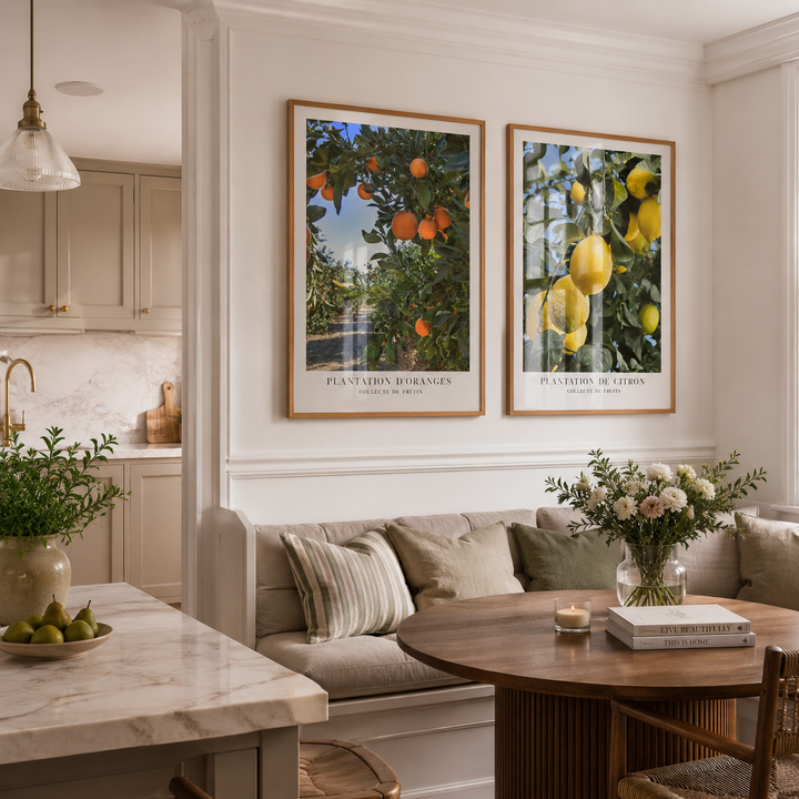 orange and lemon wall art in oak frames in luxury kitchen and dining room