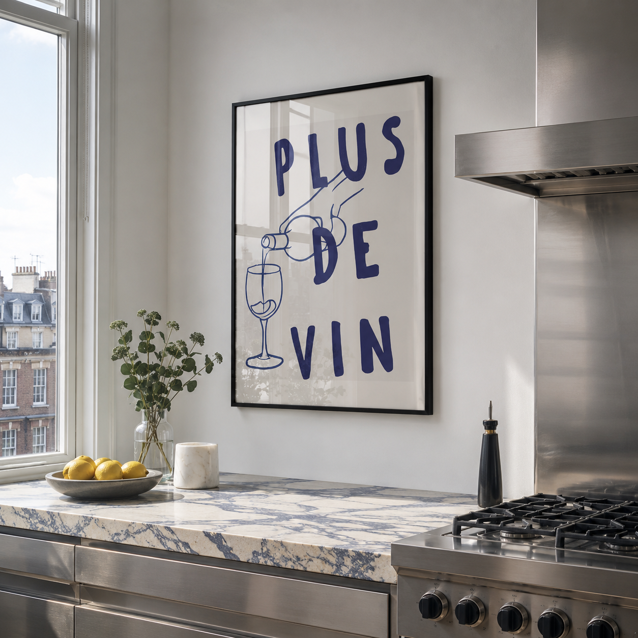 Modern kitchen with a framed poster on the wall, window, and countertop.