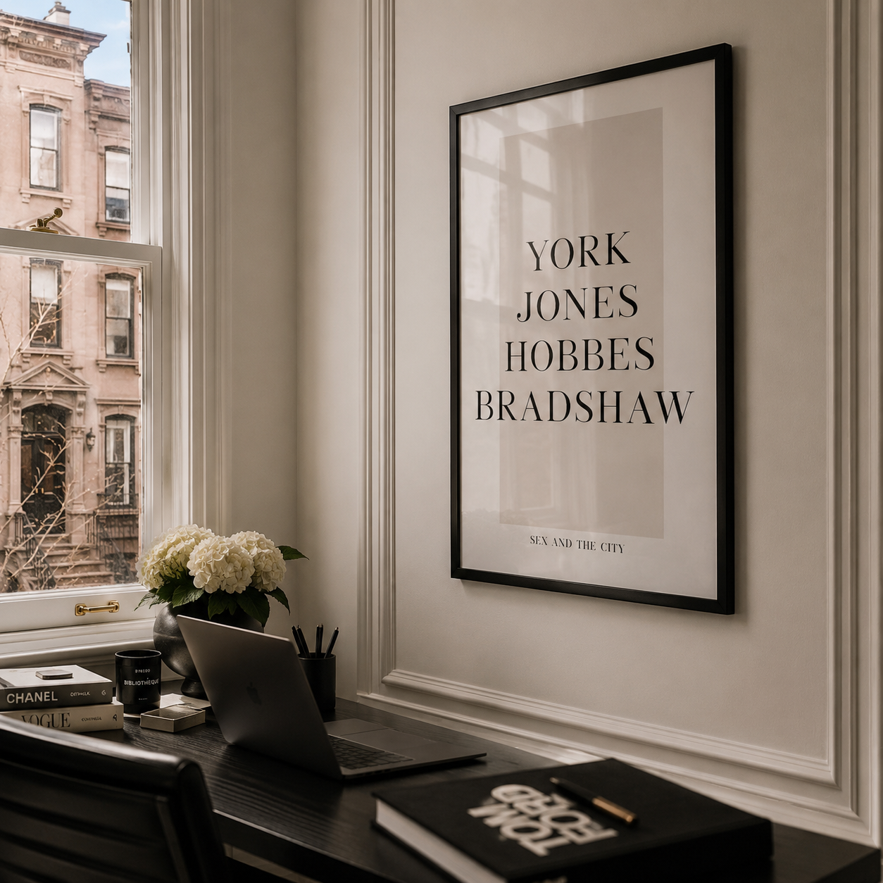 Framed sex and the city poster on a wall with a desk and window in the background