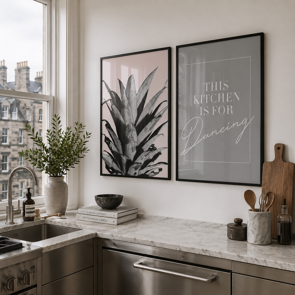 Modern kitchen with marble countertop, stainless steel appliances, and decorative wall art.