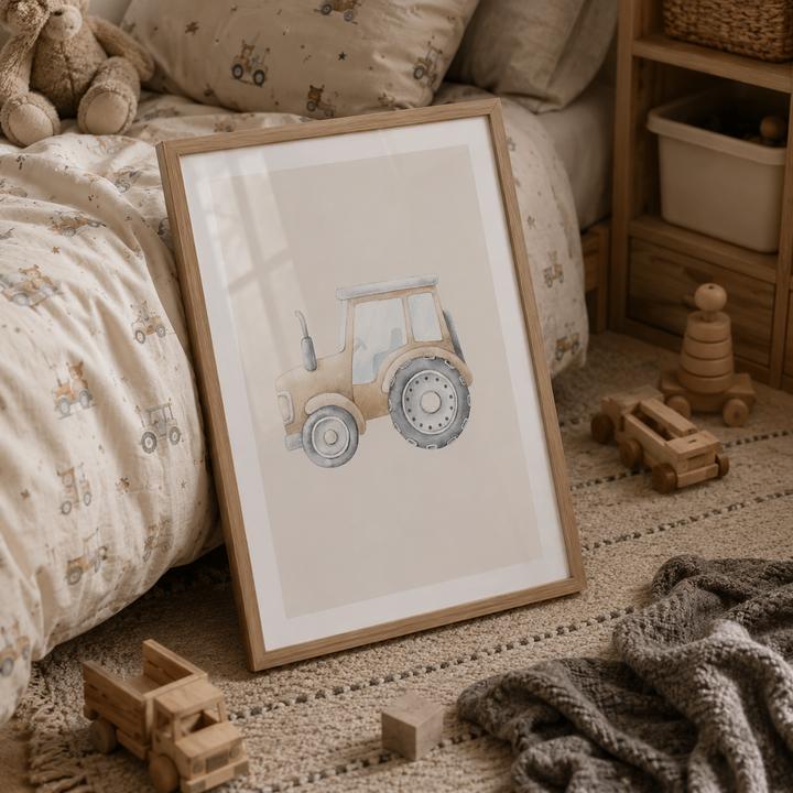 A framed watercolor print of a vintage tractor leaning against a bed in a cozy, styled children's bedroom. The print features a light beige tractor with blue-gray wheels, set in a light wood frame with a white mat.