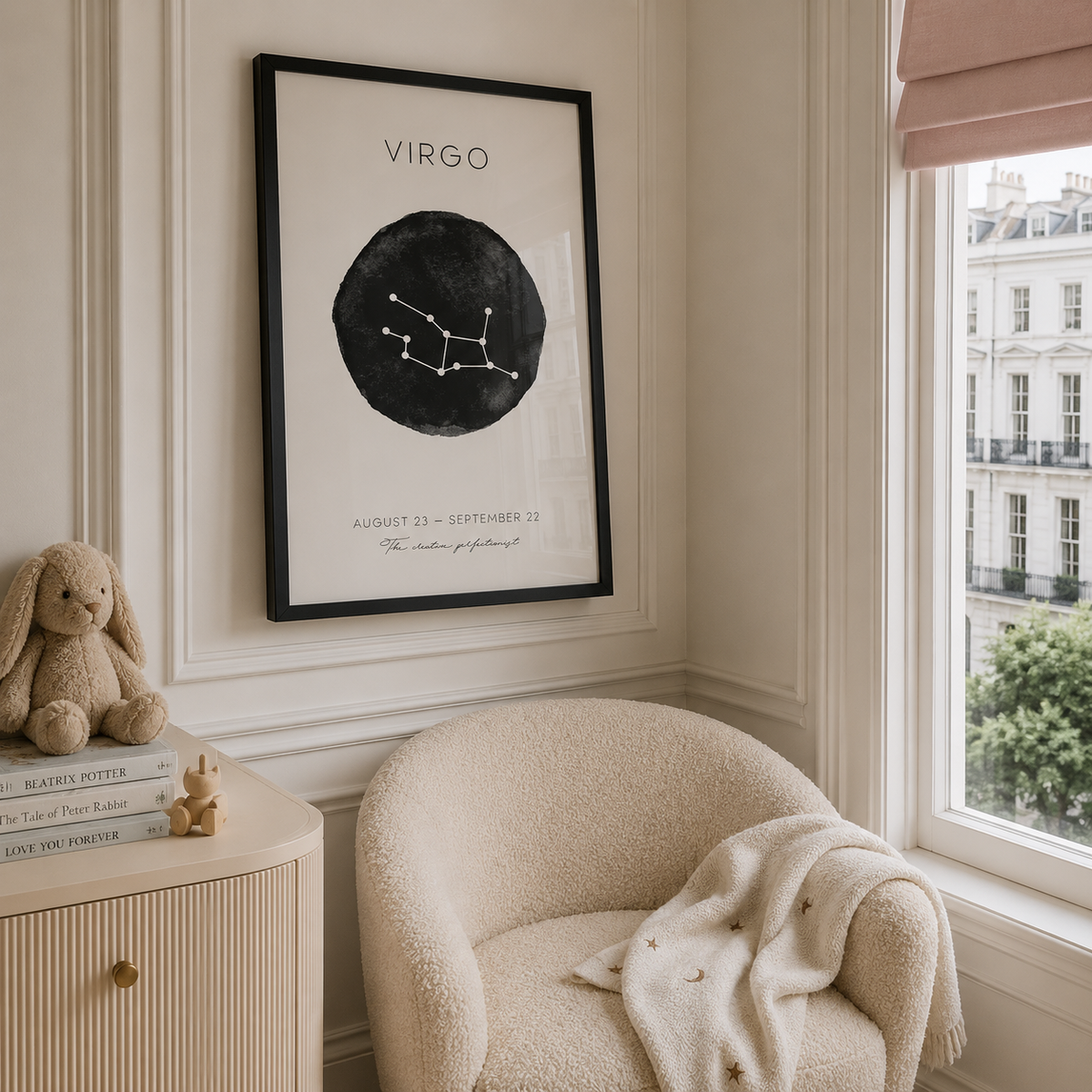 A framed black and white Virgo zodiac art print hangs on a cream wall in a styled room corner with a beige armchair, a window view, and a stuffed bunny.