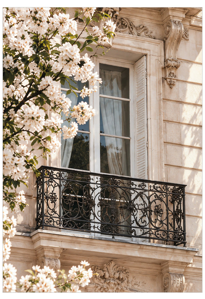 The Balcony Poster featuring a sunlit Parisian balcony with ornate black wrought iron, French windows and white spring blossom against a warm stone façade.