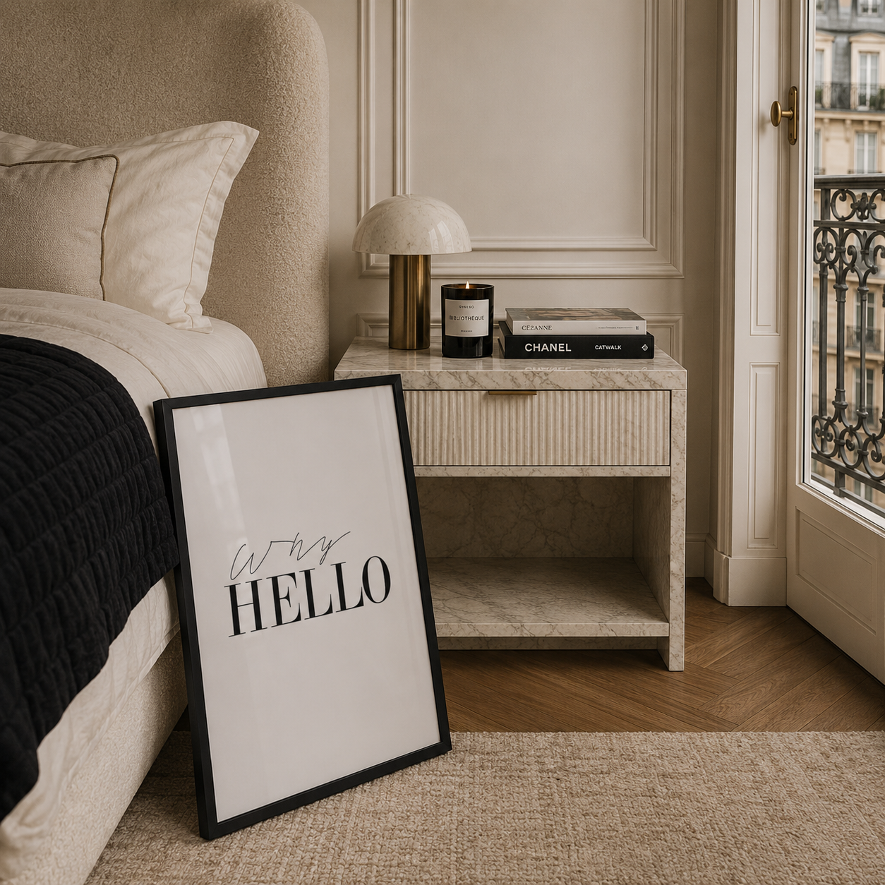 Framed print with 'Why Hello' text on a floor in a bedroom setting.