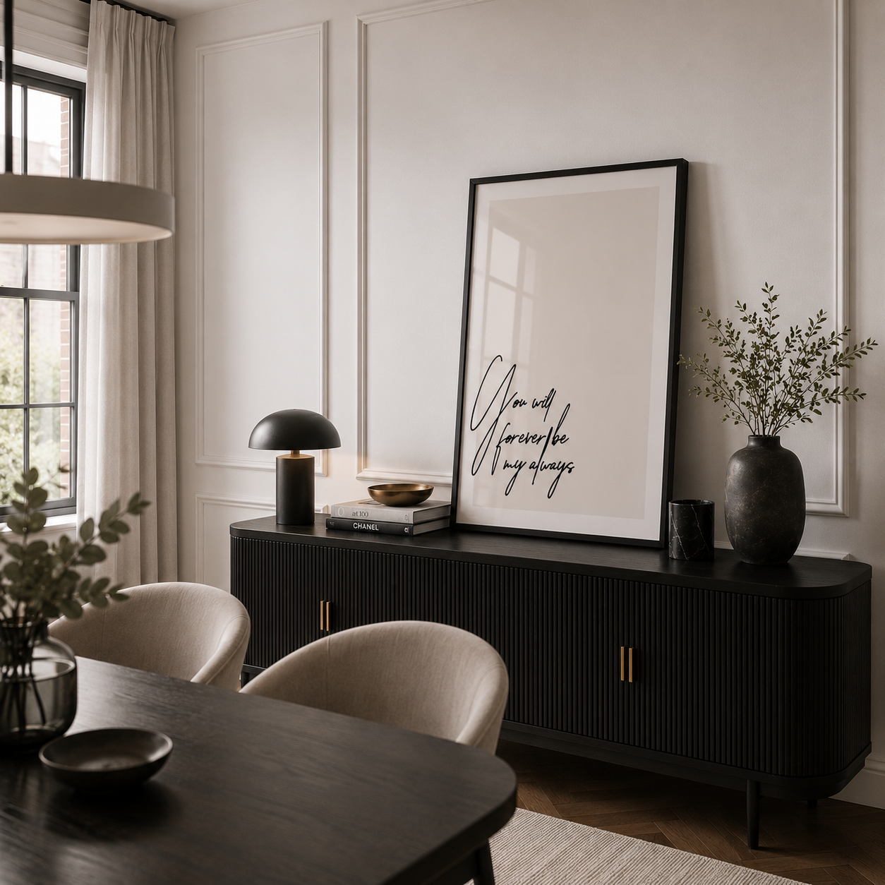 Modern interior with a black console table, chairs, and decorative items.