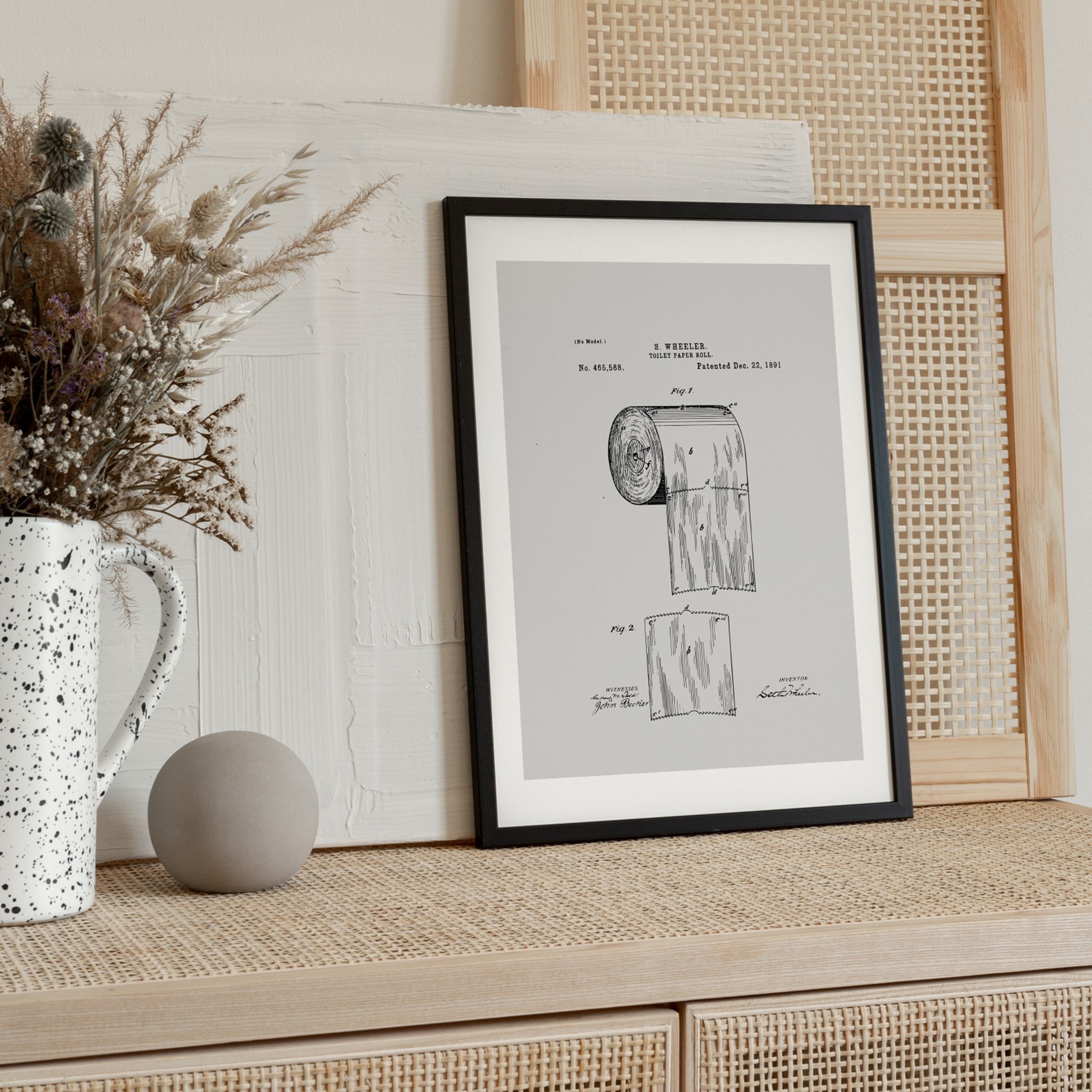 the toilet roll poster in a black wooden frame